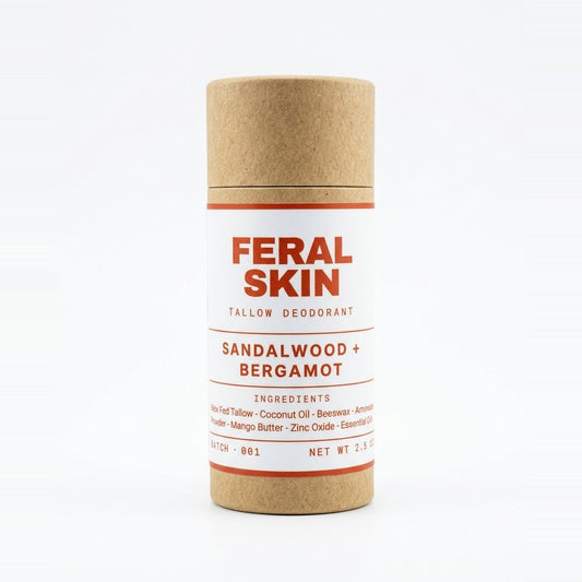 Feral Skin Tallow Deodorant, Sandalwood + Bergamot, in a kraft paper tube with a white and red label